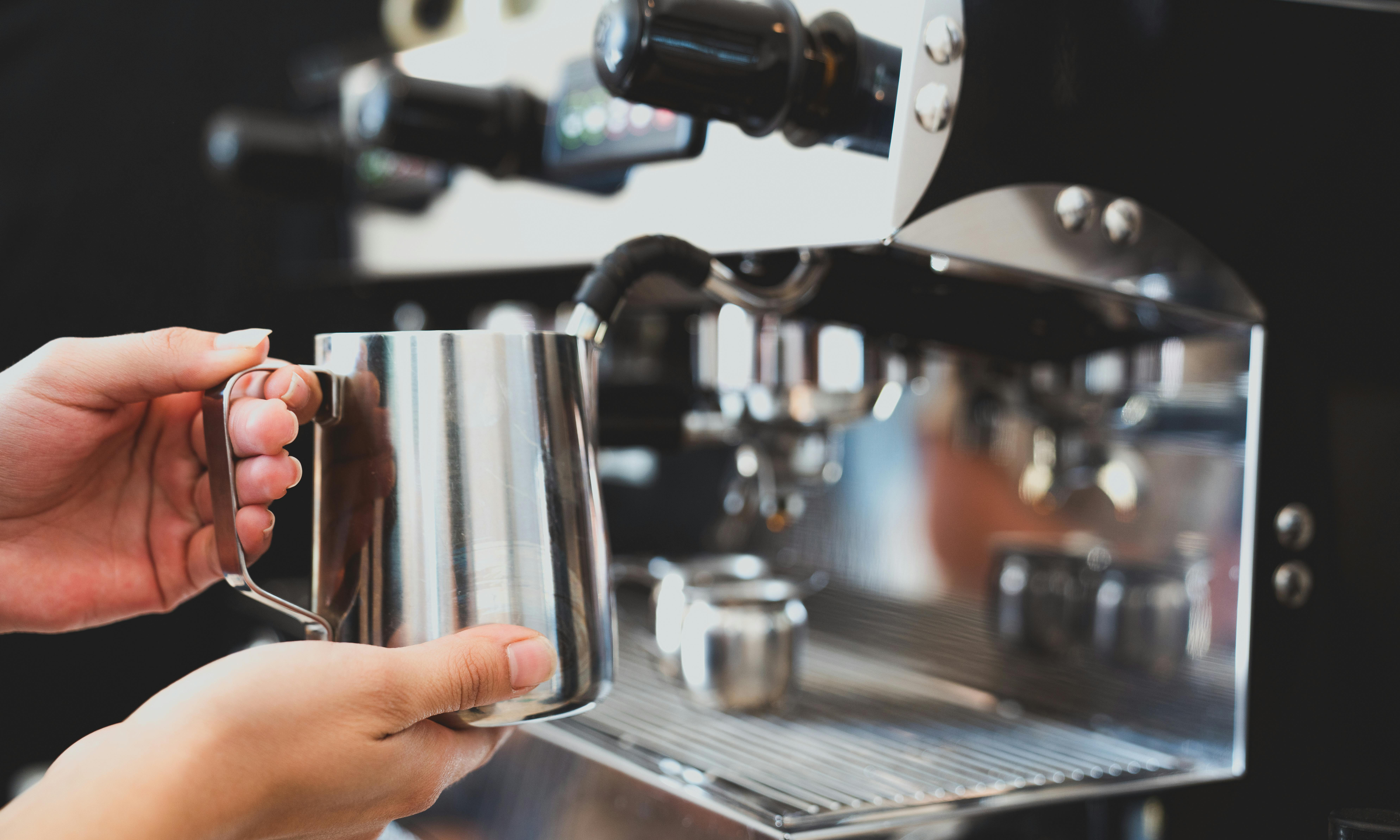 Barista Frothing Milk Photo